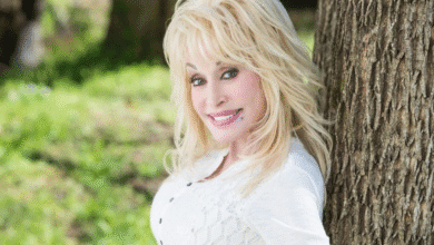 Dolly Parton Reassures Fans with a bright smile while posing outdoors, confirming her wellbeing after recent health rumors.